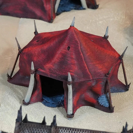 The Nomad Kings - Tribesman Hut painted photograph of the low red tent hut with tusk supports and a doorway